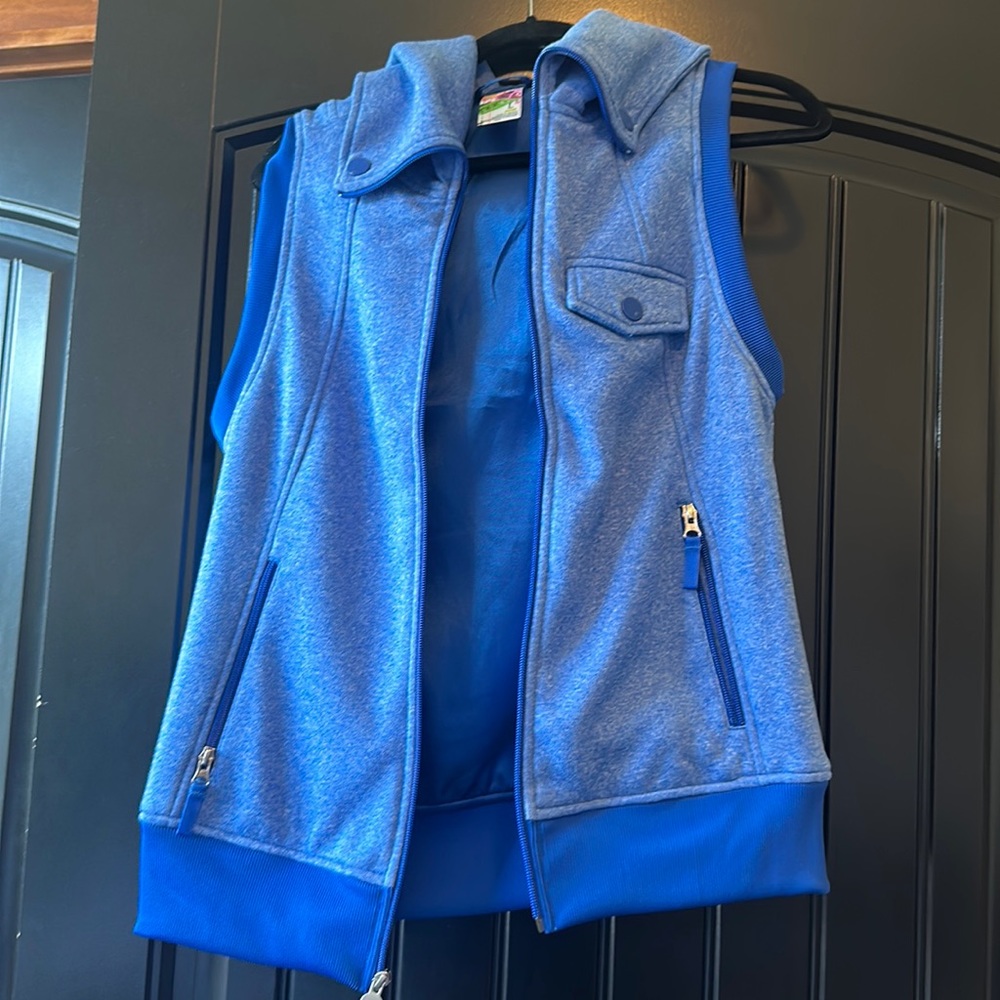 Burton women’s blue snowboarding vest size L, never worn